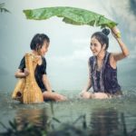 Image of young girls being happy in the rain