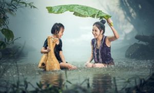 Image of young girls being happy in the rain